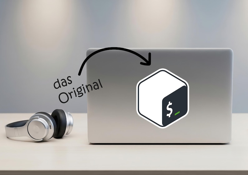 May include: A silver laptop with a sticker featuring a white and dark teal hexagonal design with a dollar sign and a green underscore. The text "das Original" is above the laptop. Silver headphones are on the table.