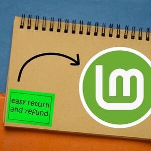 May include: A spiral-bound notepad with a green and white logo, a black arrow, and a green sticker that says "easy return and refund." A wooden pen with gold accents is to the left of the notepad.