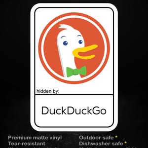 May include: A white sticker with a cartoon duck wearing a green bow tie inside an orange circle. The text "stick me! somewhere cool..." is at the top. The sticker says "DuckDuckGo" at the bottom.
