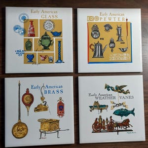 May include: Four square ceramic tiles with illustrations of Early American themes. The tiles feature images of glass, pewter, brass, and weather vanes, with text labels. The color palette includes white, gold, blue, red, and green.