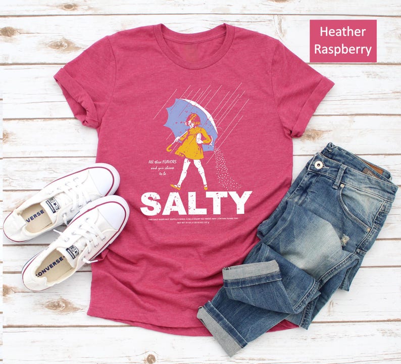 Bring summer sass to your wardrobe with the Salty Girl T-Shirt! 💕 A cozy, vintage-washed tee for women who love sunshine and statement style. Pair it with denim shorts or leggings — perfect gift for friends who live for beach vibes!