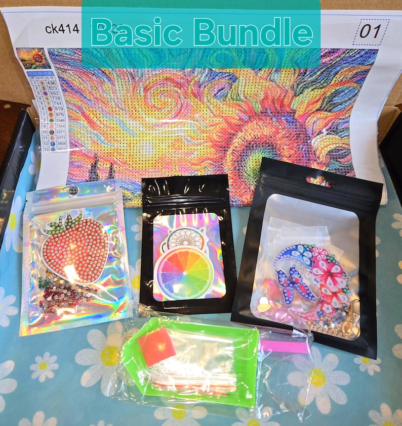 May include: A "Basic Bundle" diamond painting kit with a colorful abstract design. The kit includes a canvas, various bags of gems, and tools. The canvas features a vibrant, swirling pattern in shades of yellow, orange, and blue.