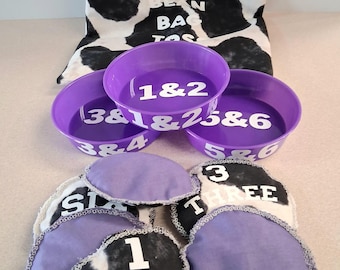 Grab, Toss, Grow! The ultimate hand made 11 piece educational bean bag game.