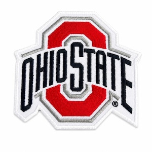 May include: Embroidered patch featuring the Ohio State University logo. The patch has a white border, a red and gray center, and the words "OHIO STATE" in black lettering. The patch is in the shape of a stylized octagon.