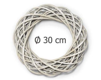 May include: White wicker wreath with a diameter of 30 inches.