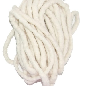 May include: A bundle of thick, off-white yarn, tightly coiled and arranged against a white background. The yarn appears soft and textured, suggesting a chunky knit or crochet project. The image highlights the natural color and texture of the fiber.