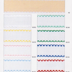 May include: A collection of white fabric ribbon trims with different colored edges. The trims have a scalloped edge and are shown in the following colors: white, green, yellow, pink, blue, and red.