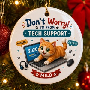 May include: A round white ceramic ornament featuring an orange tabby kitten on a laptop with the text Don't Worry! I'M FROM TECH SUPPORT, 2026, PROBLEM?, I'LL FIX IT!, and MILO. The design includes a headset, a computer mouse, and paw prints.