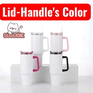 a collection of four white tumblers with pink and black handles, arranged on a white surface.