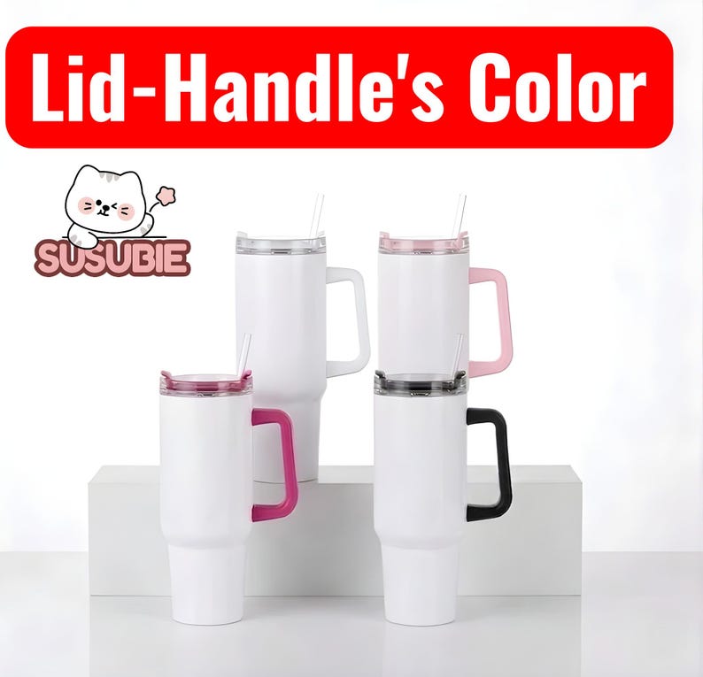 a collection of four white tumblers with pink and black handles, arranged on a white surface.