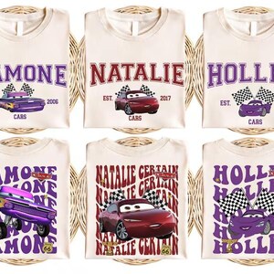 six white t-shirts with purple and red designs featuring characters from the animated movie Cars. The t-shirts are arranged in a grid with three rows and two columns.