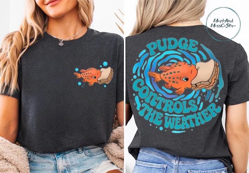 The image is a collage of two photos showing the back of a woman wearing a black t-shirt with a graphic design featuring an orange fish and the text "Pudge Controls the Weather".