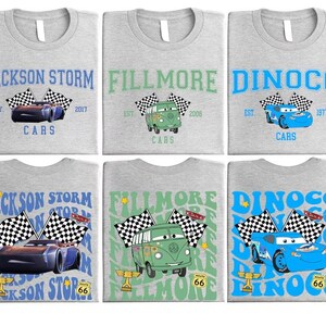 six gray t-shirts with various designs related to the popular animated movie "Cars". The designs include cars, checkered flags, and text related to the movie.