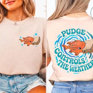 The image is a collage of two photos featuring a woman wearing a white t-shirt with a graphic design on the back. The design includes an orange fish and the text "Pudge Controls the Weather".