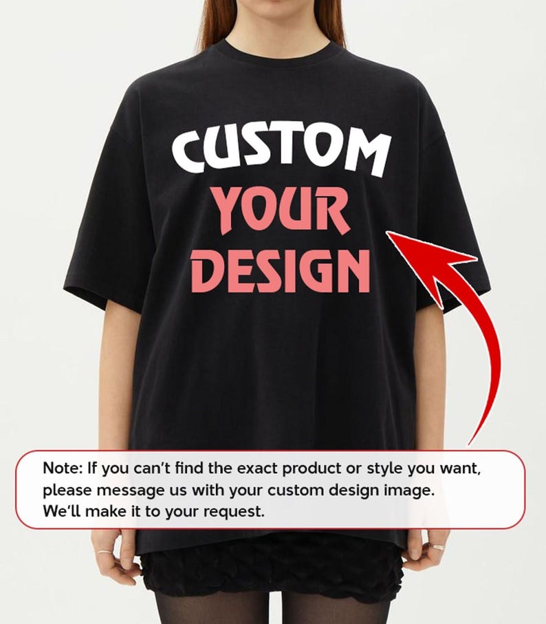 A person wearing a black t-shirt with the text "CUSTOM YOUR DESIGN" printed on it.