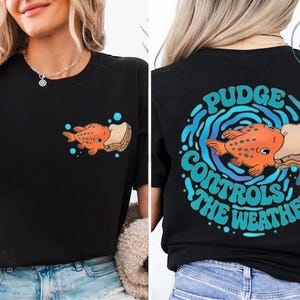 The image is a collage of two photos of a woman wearing a black t-shirt with a graphic design on the back. The design features an orange fish surrounded by bubbles and the text "Pudge Controls the Weather".