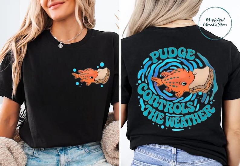 The image is a collage of two photos of a woman wearing a black t-shirt with a graphic design on the back. The design features an orange fish surrounded by bubbles and the text "Pudge Controls the Weather".