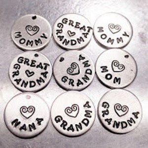 May include: Nine silver-toned metal charms with different words and a heart design. The words include "Mommy", "Great Grandma", "Grandma", "Nana", and "Mom".