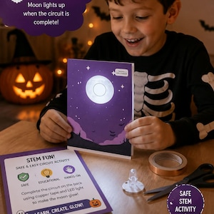 May include: A purple Halloween greeting card featuring a glowing white moon, with text reading "HAPPY HALLOWEEN". The kit includes a STEM activity instruction sheet, a roll of copper tape, a small LED light, and a pair of black scissors.