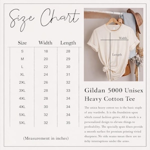 May include: A size chart for a Gildan 5000 unisex heavy cotton tee, displaying width and length measurements in inches for sizes S through 5XL. The chart includes a visual guide on a cream-colored t-shirt showing where to measure width and length.