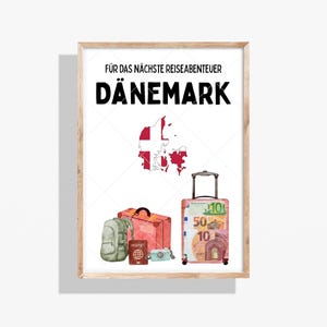 May include: A framed wall art print featuring the text FÜR DAS NÄCHSTE REISEABENTEUER DÄNEMARK, a map of Denmark with the national flag pattern, a green backpack, a red suitcase, a brown passport, a small camera, and a suitcase covered in Euro bills.