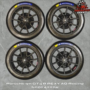 May include: Four black and gray car wheels with Michelin tires. Each tire has a blue and yellow Michelin logo. The wheels are from a Porsche 911 GT3 R REXY AO Racing Lego set.