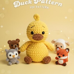 May include: A selection of crocheted toys: a yellow duck, a brown bear, a grey owl, a white sheep, and an orange fox. The image includes the text "Duck Pattern PDF Pattern" in a decorative font.