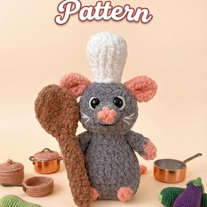 May include: Crocheted rat chef holding a wooden spoon, wearing a white chef's hat, with pink ears and paws. The image includes crocheted vegetables, pots, and the text "Ratatouille Pattern".