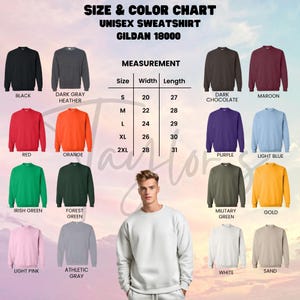 Puede incluir: Una tabla de tallas y colores para sudaderas unisex Gildan 18000. La tabla muestra varios colores, incluyendo negro, gris oscuro, rojo, naranja y verde. Se proporcionan medidas para las tallas S a 2XL, con anchos de 51 a 71 cm y largos de 69 a 79 cm.