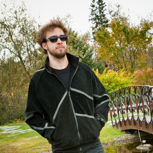 Suede jacket with asymmetric seam patterns.
