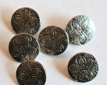 Silver colored plastic button
