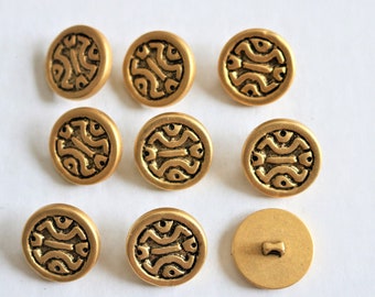9 brass-colored abstract pattern buttons