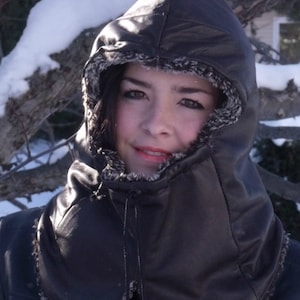 Upcycled leather hood with pompon