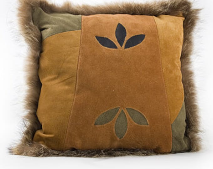 Upcycled orange and blue suede cushion.