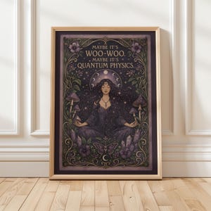 May include: Framed art print featuring a woman meditating, surrounded by mushrooms, crystals, and floral elements. The artwork has a dark purple and black color scheme with the text "MAYBE IT'S WOO-WOO. MAYBE IT'S QUANTUM PHYSICS."