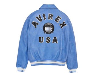 Avirex USA Edition Blue Leather Bomber blends classic motorcycle ruggedness with contemporary style. Its rich navy-blue finish and smooth