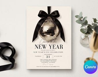 May include: A New Year's Eve invitation card featuring a silver disco ball hanging from a black satin ribbon. The text reads Cheers to the NEW YEAR, PLEASE JOIN US FOR A NEW YEAR'S EVE CELEBRATION, TUESDAY DECEMBER 31 AT 8:00 PM, and location details.