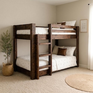 May include: A dark brown wooden bunk bed with a built-in ladder on the front. The bed features white bedding with a small grey pattern, a solid brown square pillow on the bottom bunk, and a rectangular brown pillow on the top bunk.
