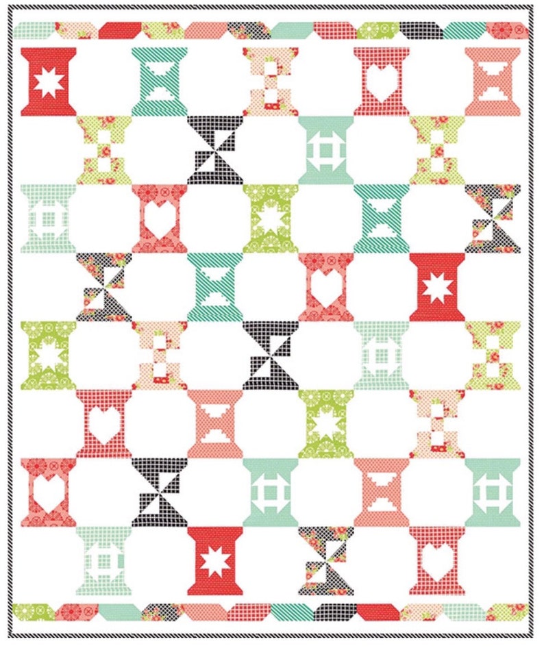 May include: A patchwork quilt featuring a repeating pattern of spools in red, teal, green, and black. Each spool has a different design, such as stars, hearts, and geometric shapes. The quilt is bordered with a black and white rope design.