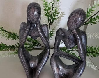 2 beautiful figures in a set, cast in black/grey/rose and glitter from resin, approximately 12.5 cm high.