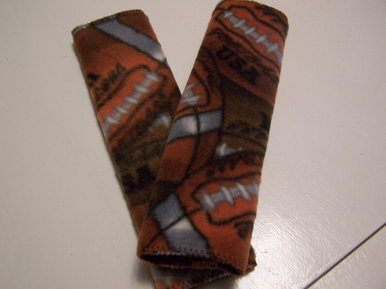 Pair Of Car Seat Belt Strap Covers Or Cushions Harness Backpack Brown Burnt Orange Football Pattern