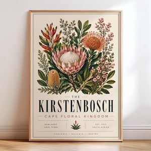 May include: A framed botanical print featuring a large pink protea, orange pincushion protea, and various green foliage. The text reads THE KIRSTENBOSCH CAPE FLORAL KINGDOM, NEWLANDS CAPE TOWN, EST. 1913 SOUTH AFRICA, CONSERVE EDUCATE INSPIRE.