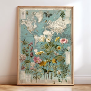 Peut inclure: Une affiche encadrée représentant une carte du monde vintage en bleu et blanc. La carte est ornée d'illustrations colorées de diverses fleurs et papillons. Le cadre en bois ajoute une touche classique à cette pièce décorative.