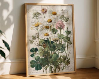 May include: A framed botanical print featuring a variety of flowers, including daisies and clover, with detailed illustrations and handwritten script. The artwork is set in a light-colored wooden frame, creating a vintage aesthetic.