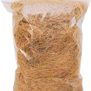 May include: A transparent plastic bag containing a quantity of brown, fibrous material. The material, likely coconut coir, is densely packed. The bag features a clear, zip-top closure, commonly used for storage and packaging.