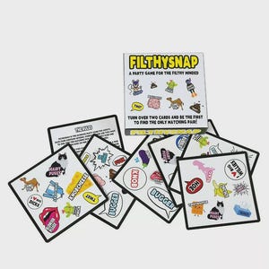 May include: A party game called "FilthySnap" with a box and several cards. The box reads "A Party Game for the Filthy Minded". The cards have various illustrations and words like "Bugger", "Knob", and "Hairy Pussy".