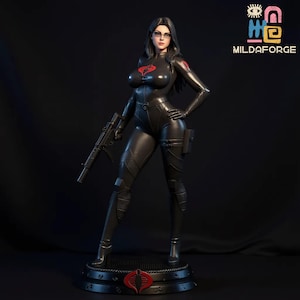 May include: A black statue of a woman in a black bodysuit, holding a rifle. She wears glasses and has a red Cobra emblem on her chest. The statue is on a black base with a red Cobra logo.