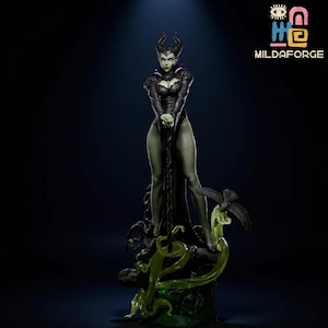 May include: A detailed figurine of a character with black horns, wearing a black dress, and holding a staff. A black bird is perched on a green, vine-like structure at the base. The figurine has a dark green complexion and is set against a dark background.