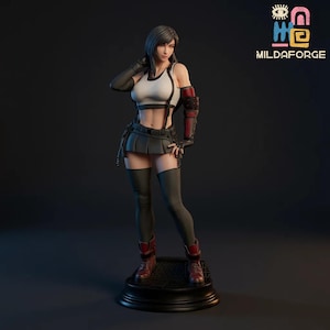 May include: A detailed figurine of a female character in a white crop top, black skirt, and knee-high socks. The figure has short black hair and is posed with one hand on her head. The figure is standing on a black base.