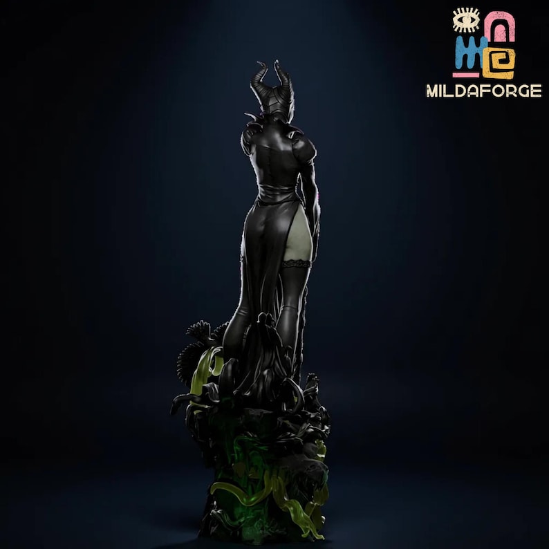 May include: A black figurine of a character with horns, wearing a long dress and boots. The figurine is standing on a dark base with green accents. The text "MILDAFORGE" is visible in the upper right corner.
